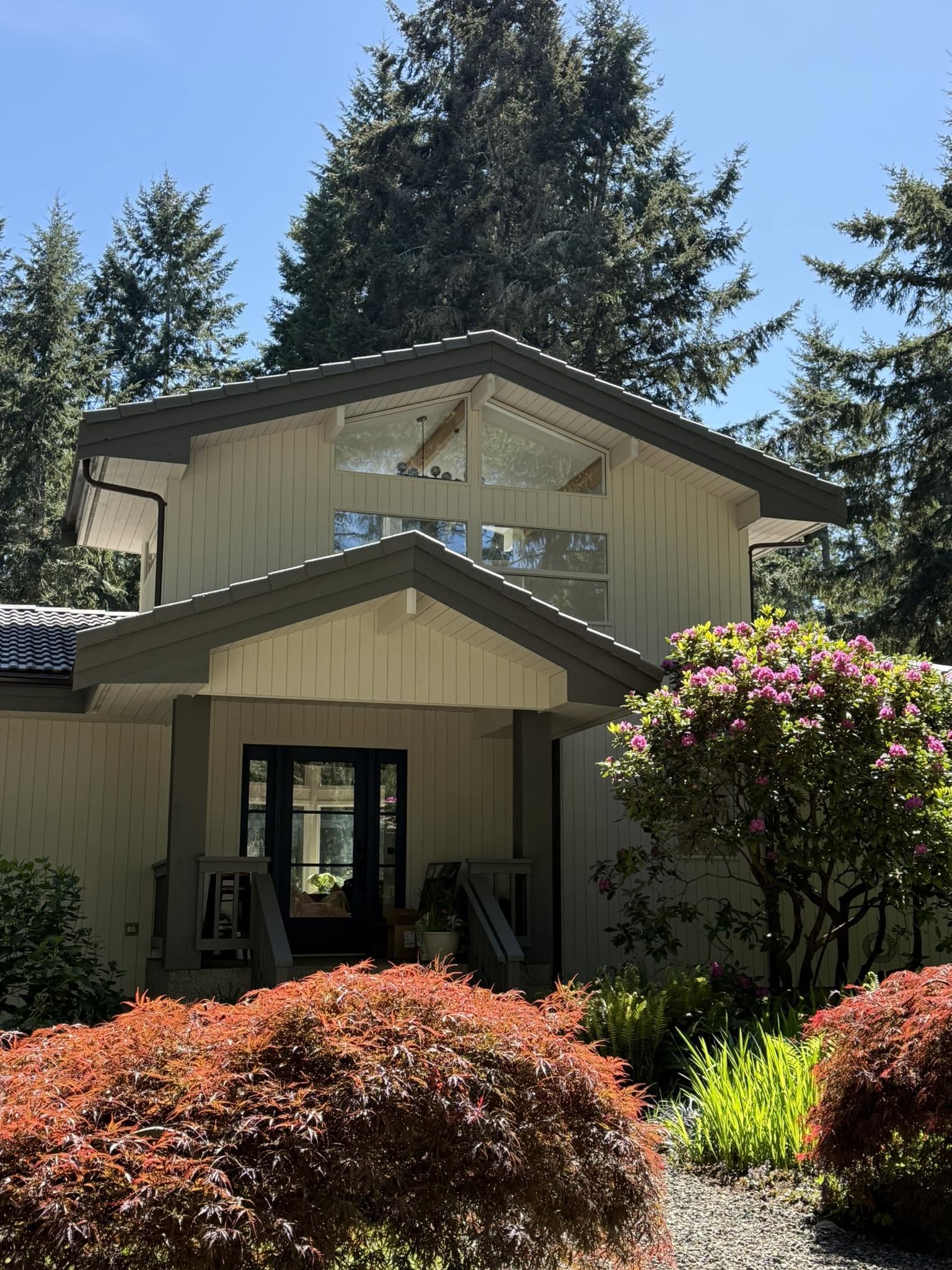 Exterior house painting with cream siding and charcoal trim in Kent WA