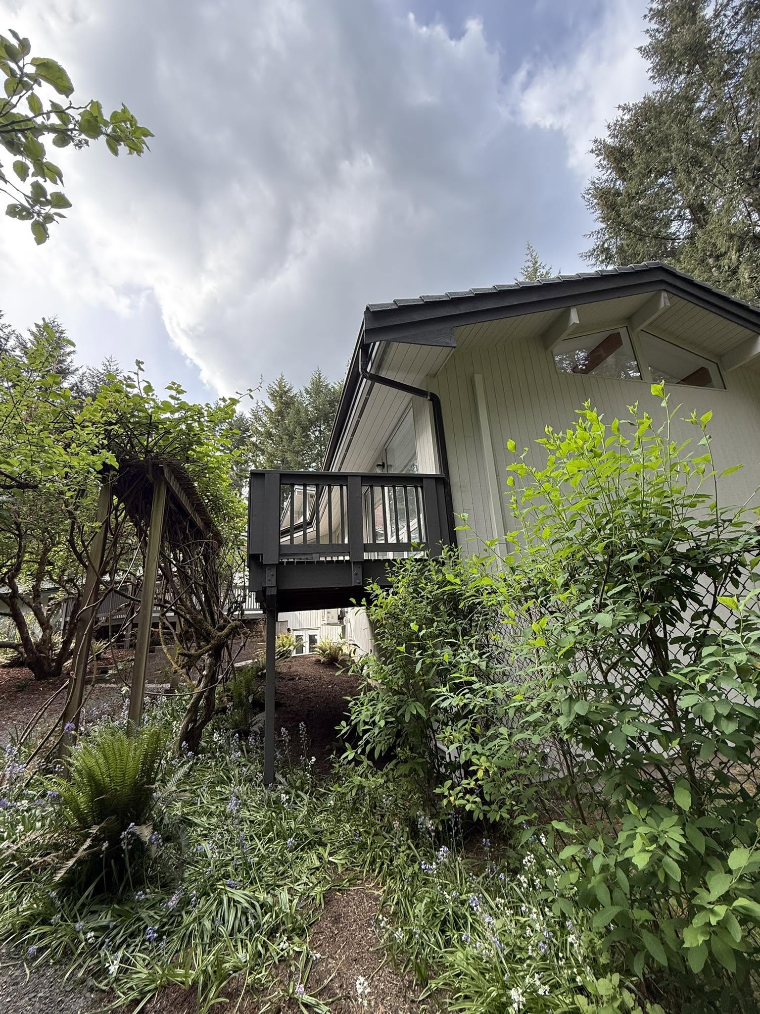 Exterior painting with charcoal balcony and trim on a Kent WA home