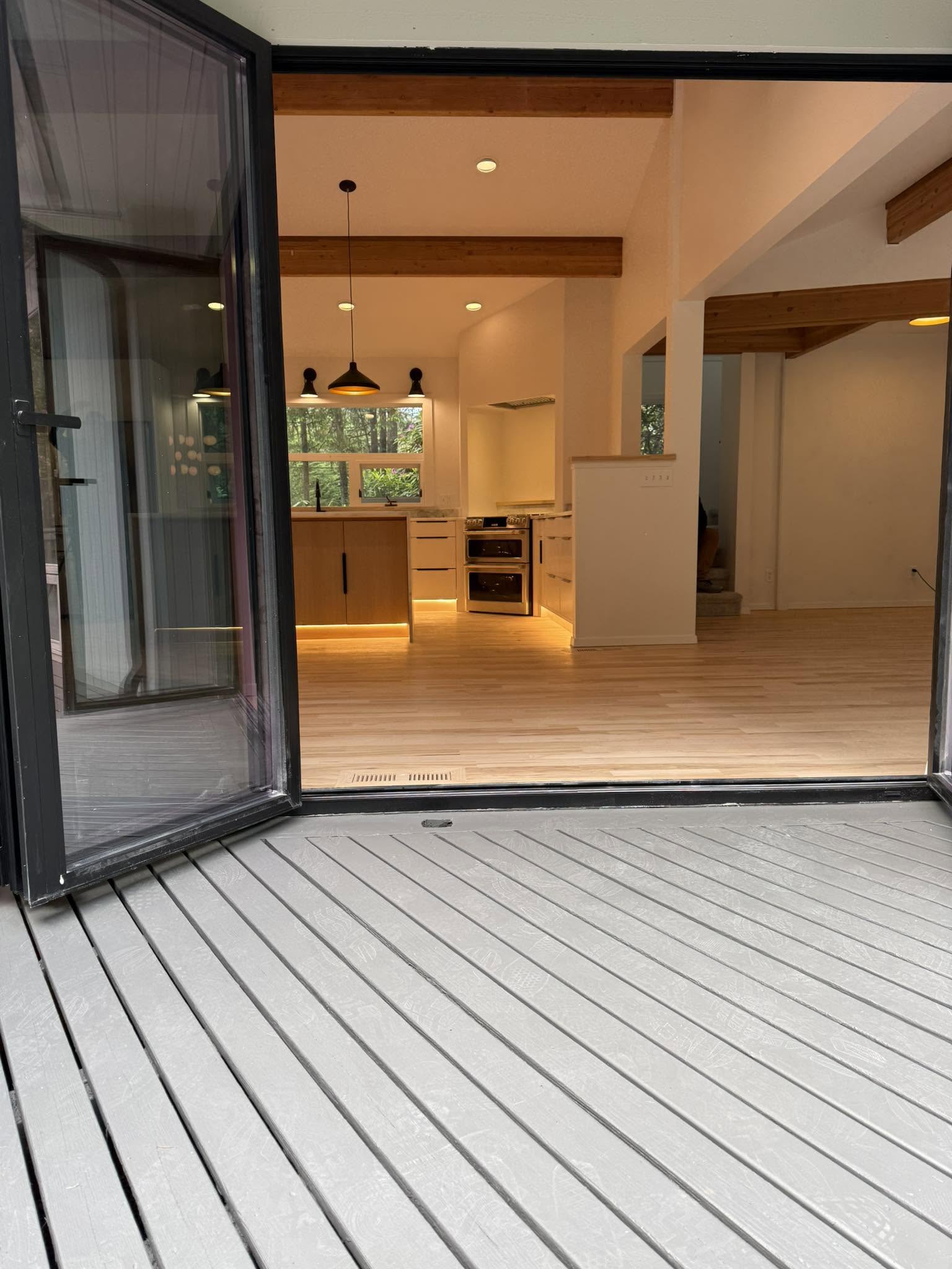 White interior walls and stained deck at a King County home by Blackhawk Pro Painting