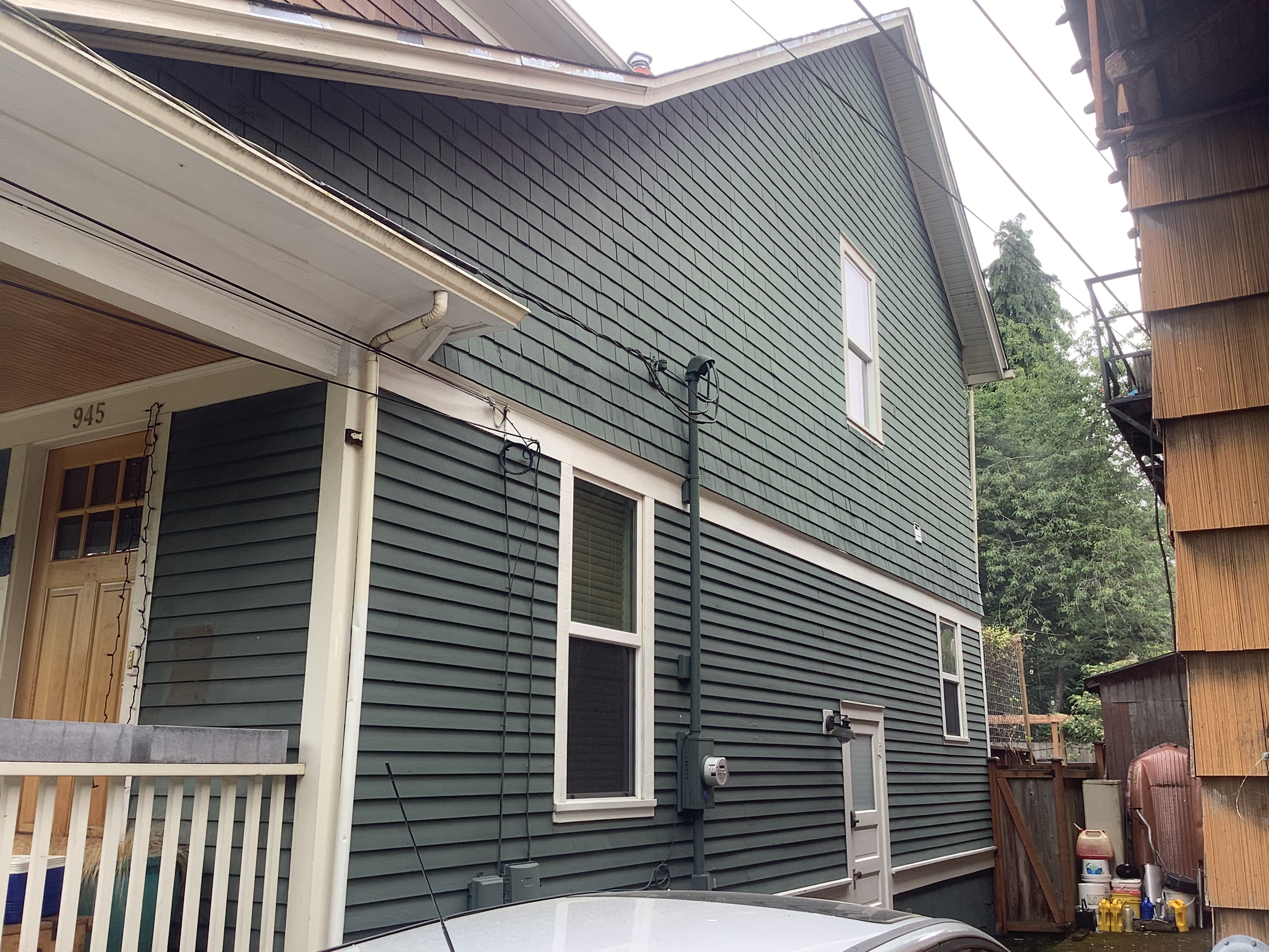 Green lap siding on a Seattle home before exterior painting